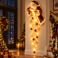 Lighted Santa cascade wall decor glowing in a holiday entryway